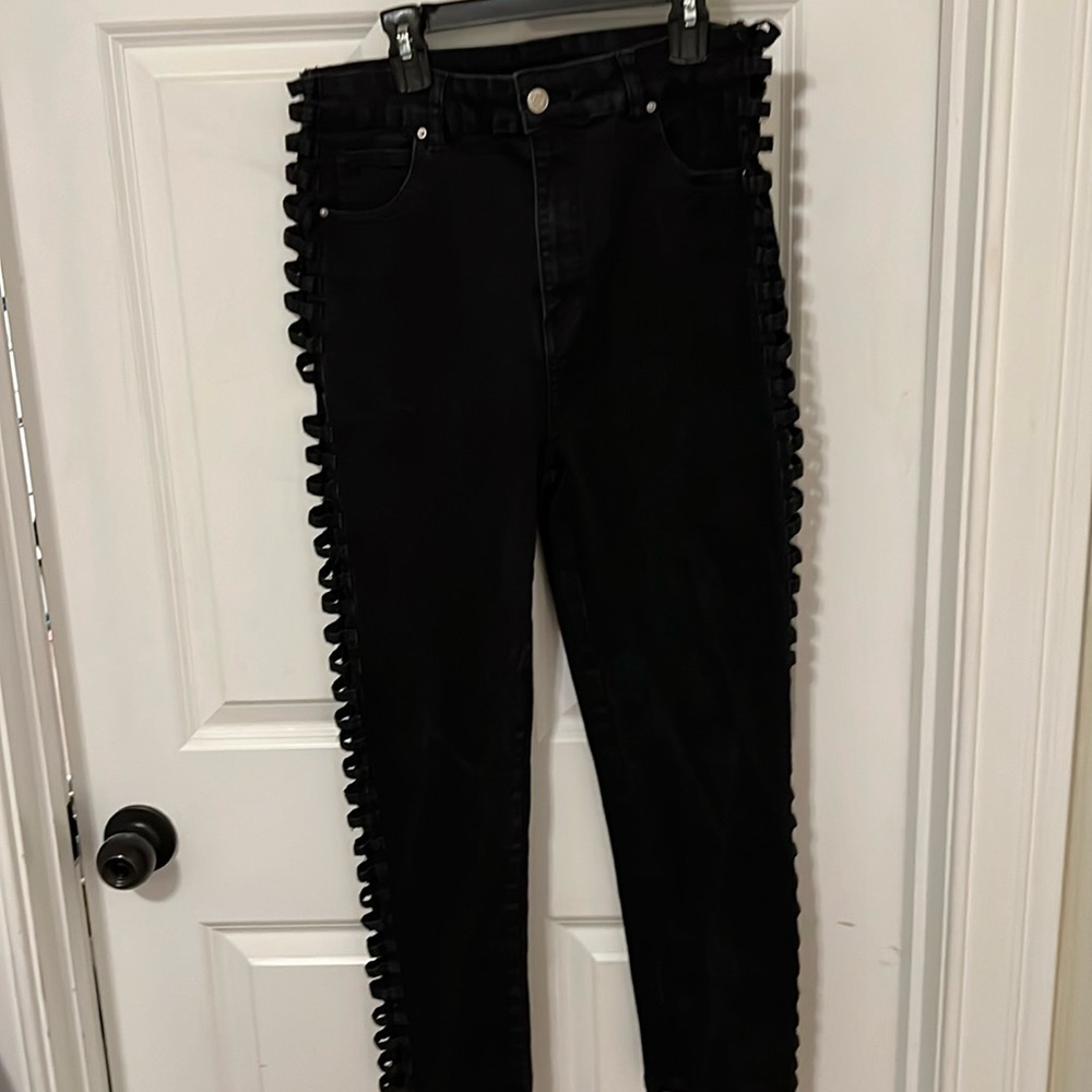 Black skinny jeans with side cutouts